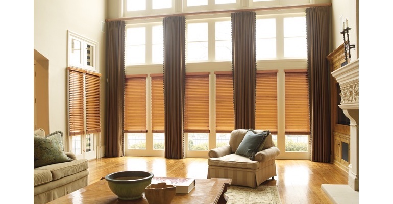 Atlanta great room with wood blinds and floor to ceiling draperies.